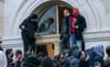 Trump supporters smash windows at the United States Capitol on Jan. 6, 2021