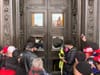 MAGA Trump supporters bashing in windows at the U.S. Capitol on January 6, 2021.